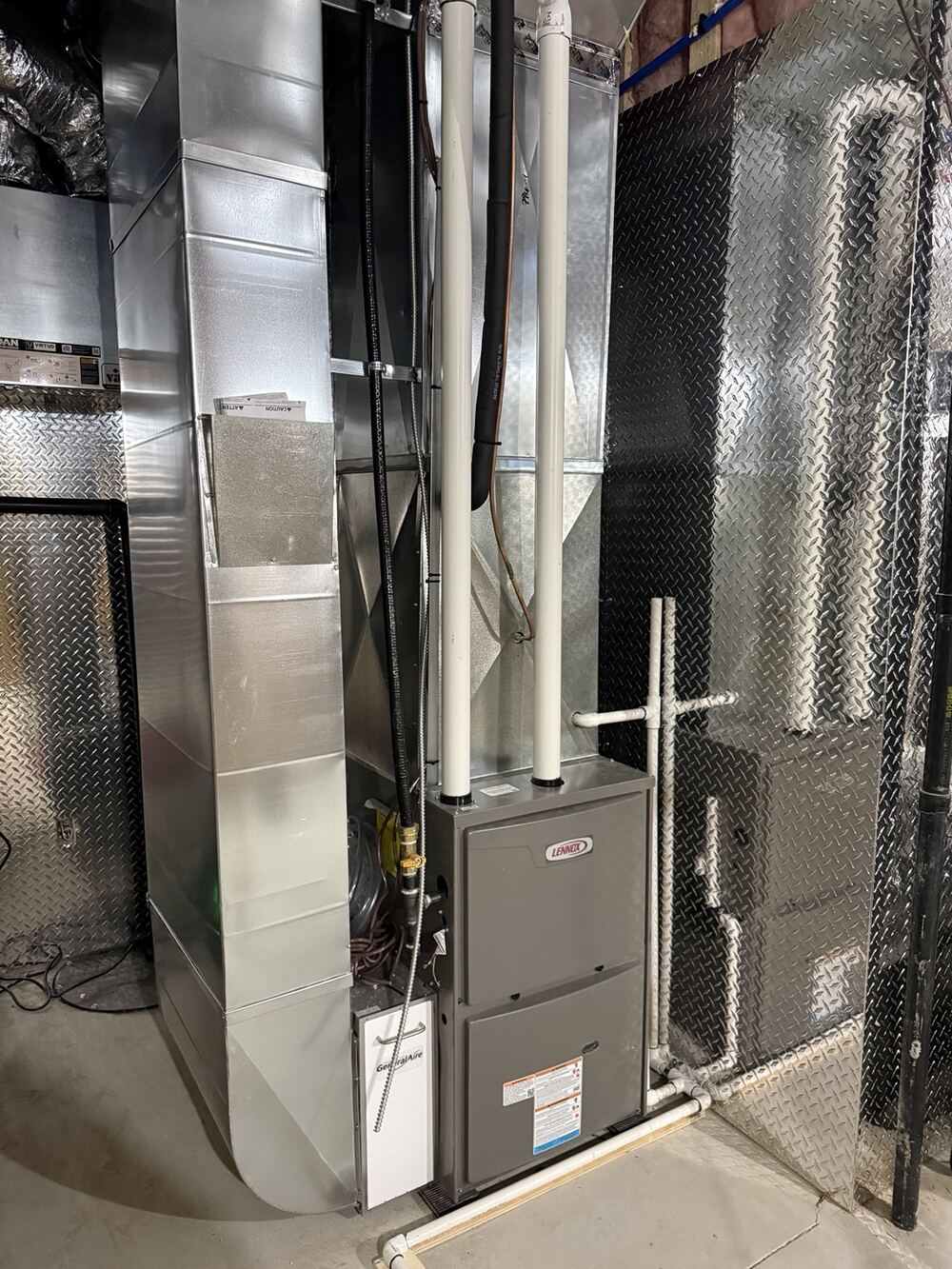 Lennox high-efficiency furnace with custom sheet-metal ductwork installed by Airmaxx